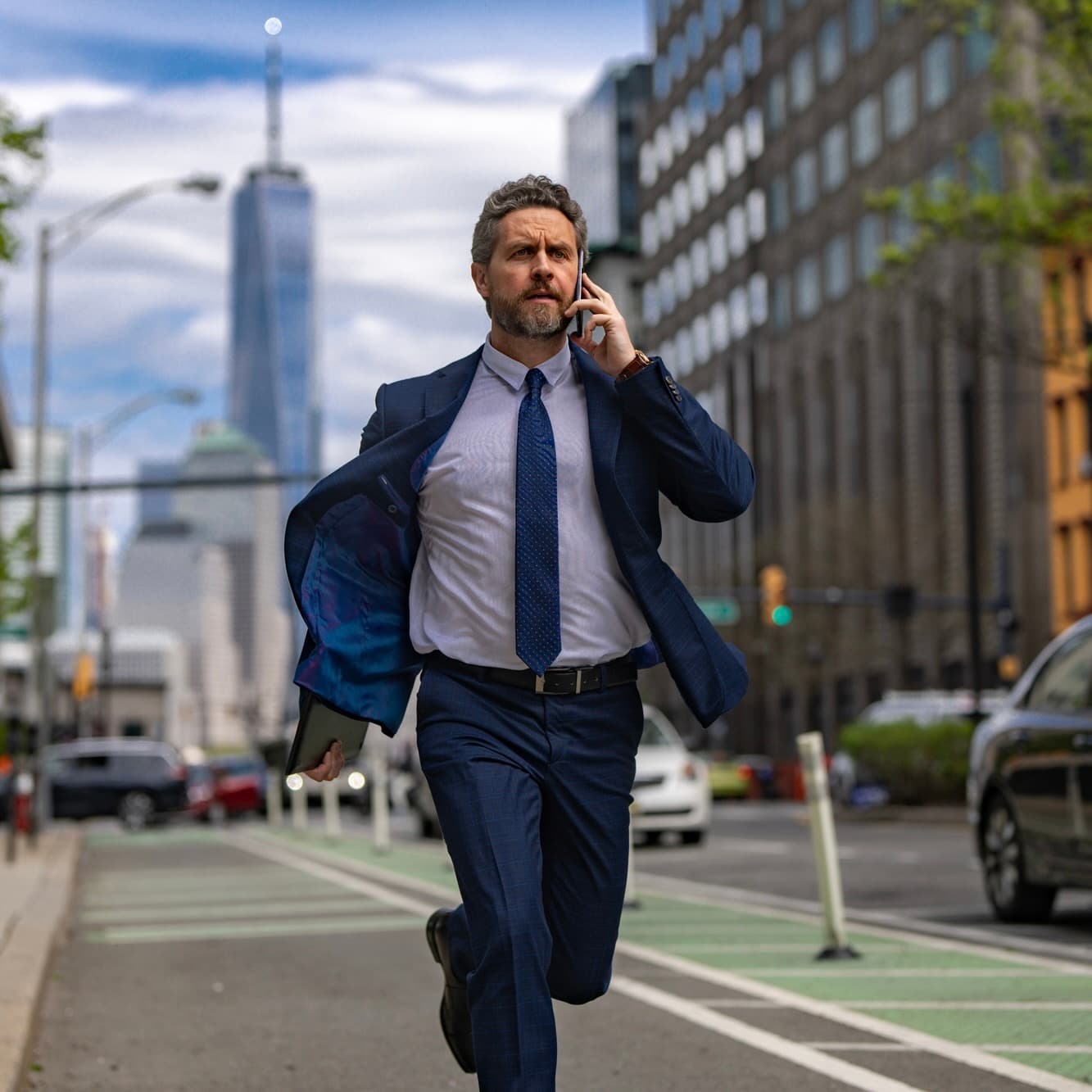 Busy professional running through city - training that fits your work schedule