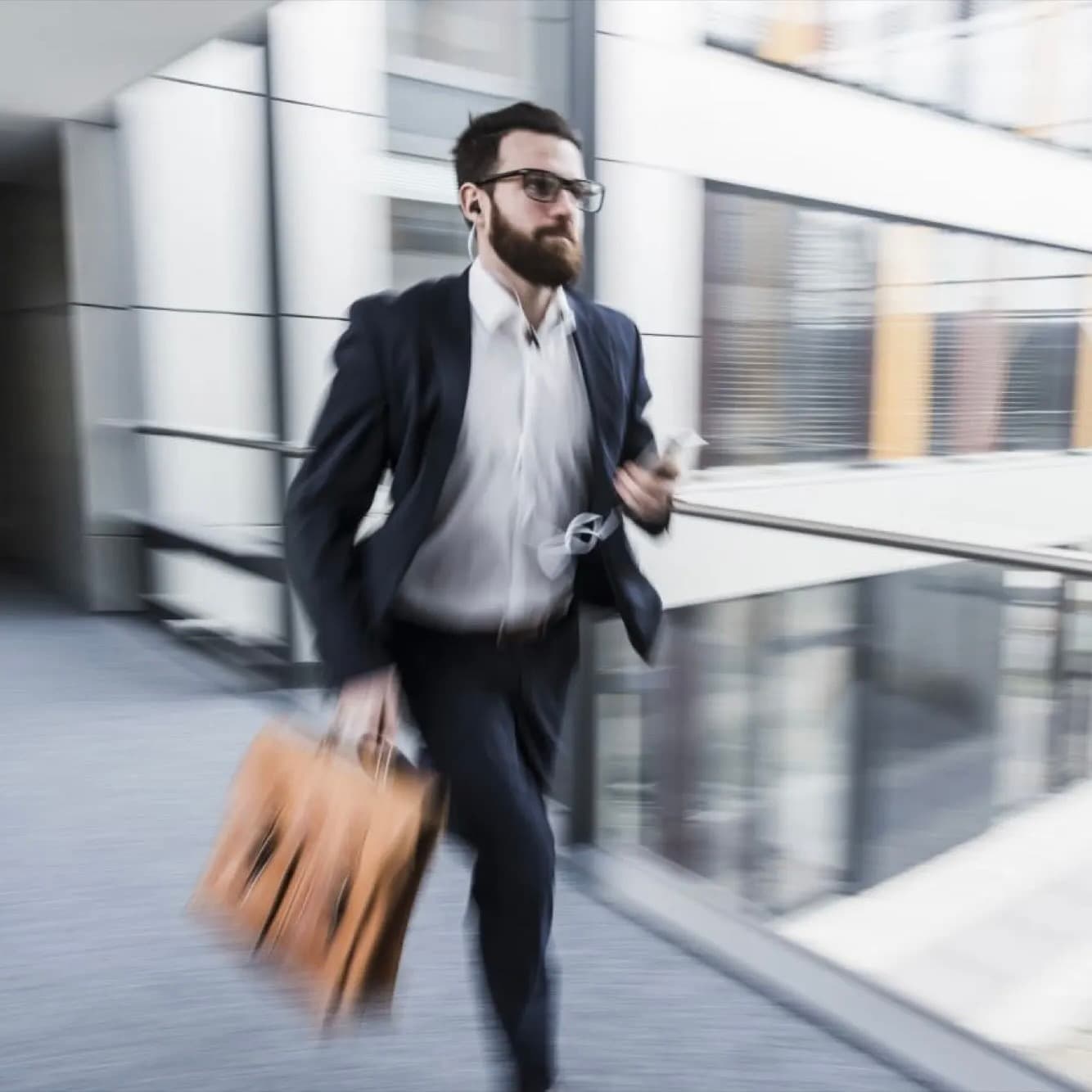 Busy professional rushing with briefcase - training that fits your lifestyle